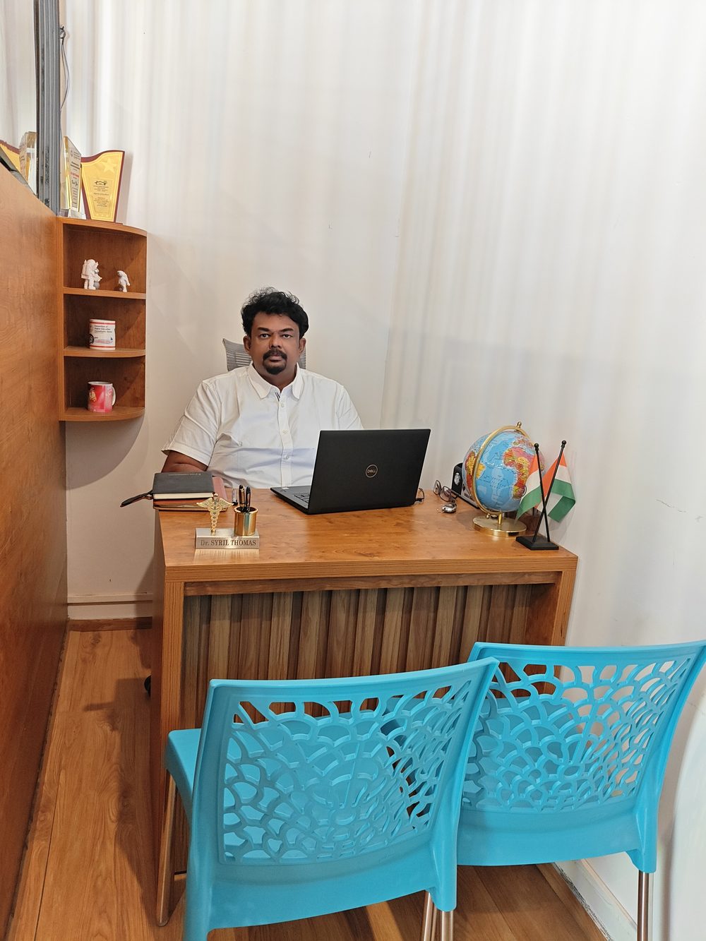 Dr. Syril Thomas at his Pioneer office